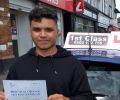 John with Driving test pass certificate